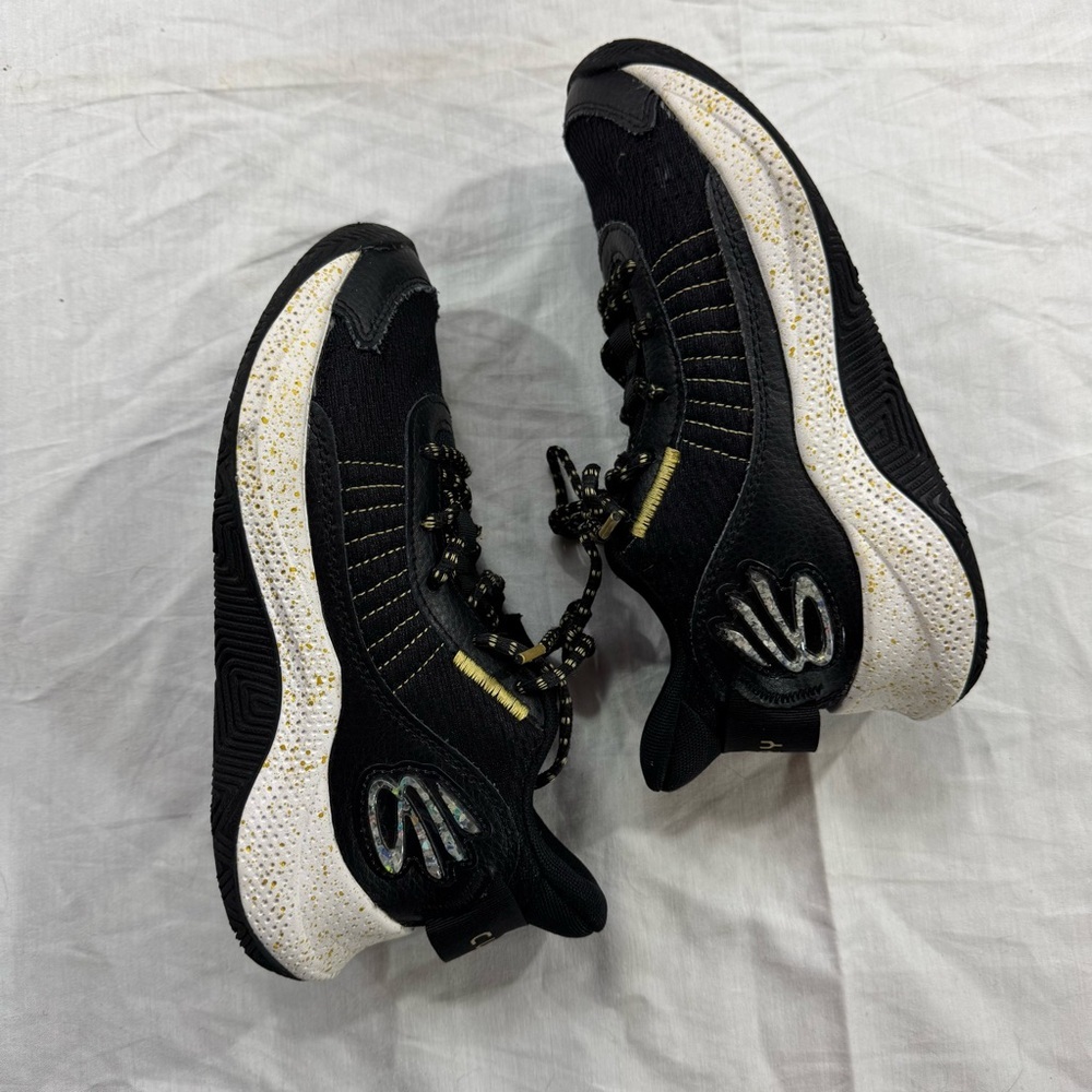 28. Kids Under Armour Black Sneakers with Yellow Stitching (4.5Y)